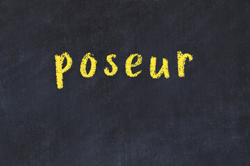 Black chalkboard with inscription poseur on in