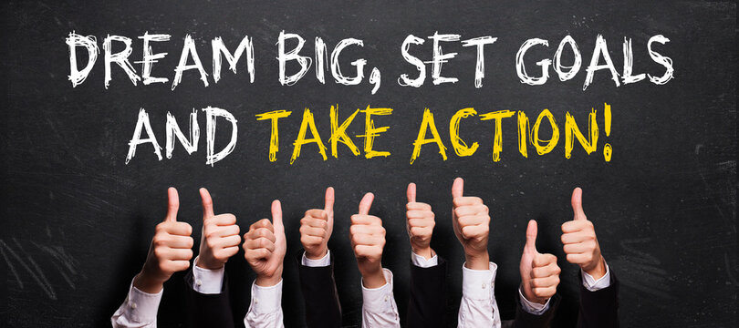 many thumbs up to message DREAM BIG, SET GOALS AND TAKE ACTION! on a blackboard