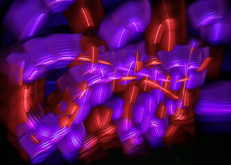 light painting abstract background. curves and waves of purple and red light against a black background