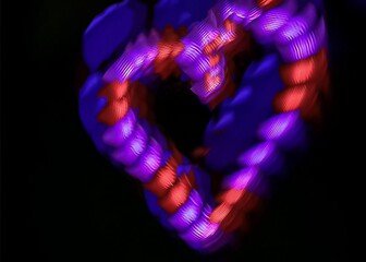 Light painting heart shape over black background