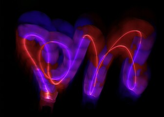 light painting abstract background. curves and waves of purple and red light against a black background