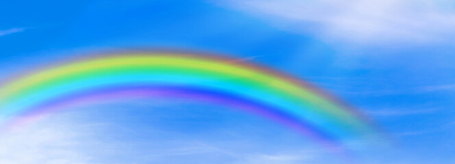 Rainbow background and sky with white clouds