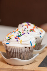 food cupcake with icing and sprinkles