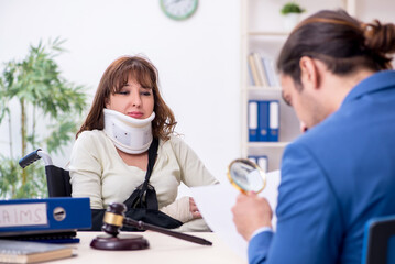 Injured woman and male judge in the courtroom