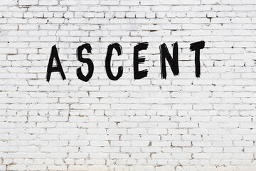 Inscription ascent painted on white brick wall