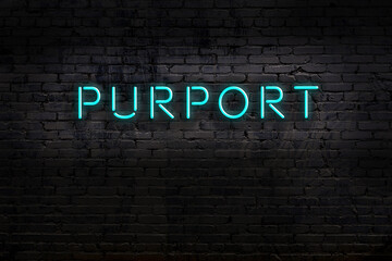 Night view of neon sign on brick wall with inscription purport