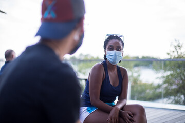 A man and a woman go on an outdoor date during a pandemic