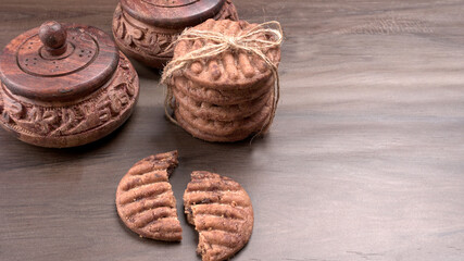 Homemade oatmeal cookies with flax and sesame seeds on white wooden table, copy space. Healthy vegan oat cookies