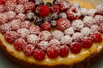 Homemade Cheesecake with Fresh Raspberries and Currants - Healthy Organic Summer Dessert Cheesecake Pie. Vanilla Cheese Cake with Wild Berry