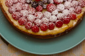 Homemade Cheesecake with Fresh Raspberries and Currants - Healthy Organic Summer Dessert Cheesecake Pie. Vanilla Cheese Cake with Wild Berry