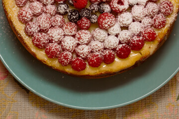 Homemade Cheesecake with Fresh Raspberries and Currants - Healthy Organic Summer Dessert Cheesecake Pie. Vanilla Cheese Cake with Wild Berry