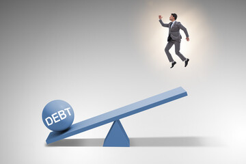 Debt and loan concept with businessman and seesaw