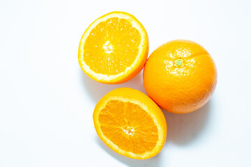 Sliced fresh orange fruit on white background