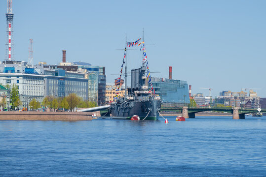 ST. PETERSBURG, RUSSIA - MAY 24, 2020: Cruiser "Avrora" in the cityscape on a sunny May morning