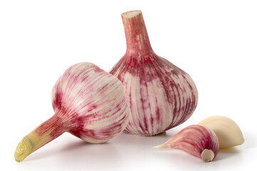 Two heads and clove of fresh red garlic on a white background. Full depth of field. With clipping paths