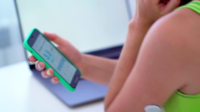 Diabetics control and checking glucose level with a remote sensor, computer and smartphone. Online monitoring glucose levels without blood using digital glucose meter