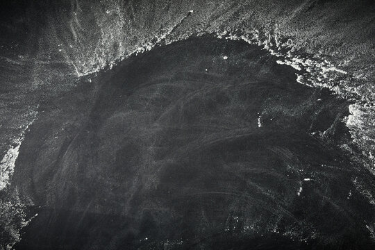Frame of scattered flour on slate with copyspace