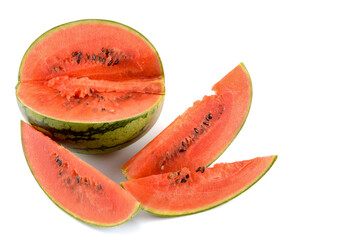 ripe watermelon cut into slices on a white background, close-up, text space