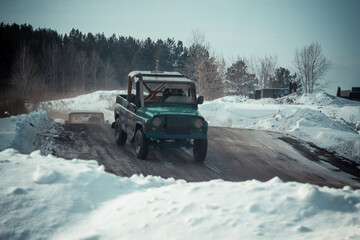 Dirty race cars ride off-road at competitions