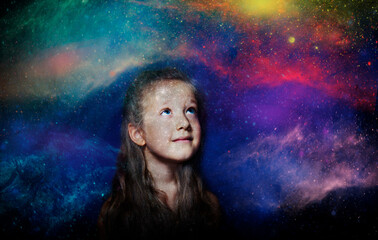 Childhood and dream concept. Conceptual image with girl dreaming about space, stars, planets.