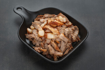 well done roast beef slice on black plate