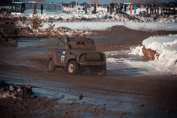 Dirty race cars ride off-road at competitions