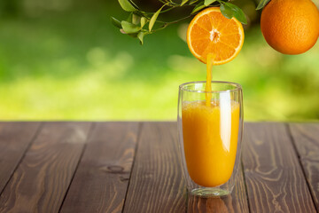orange juice pouring into glass
