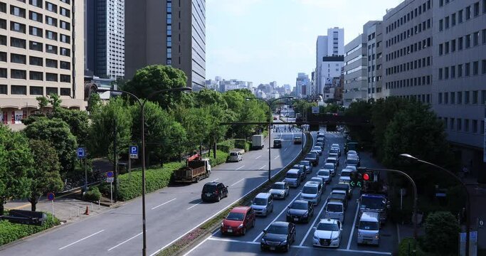 A city street at Yasukuni avenue in Tokyo daytime wide shot