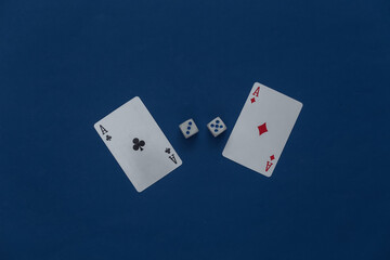 Ace of tambourine and clubs with dice on a classic blue background.
