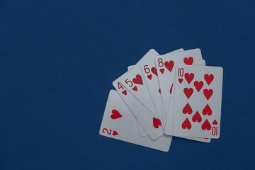 Obraz premium A deck of playing cards on classic blue background.