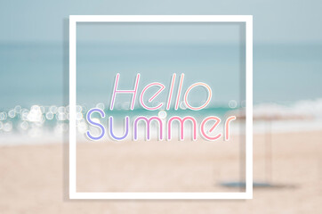 Hello summer words on blur tropical beach with bokeh sunlight wave abstract background. Summer vacation and travel holiday concept.