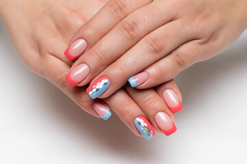 Peach, coral blue french manicure with silver rhombus on long square nails closeup 