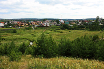 Fototapeta na wymiar Village in the green field