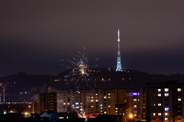 New Year's evening city with fireworks