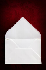 Vintage Envelope Open Top View over Rich Red Background