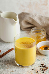 Moon milk for better sleep. Turmeric Golden milk with cinnamon, honey. Ayurvedic drink. Trending...