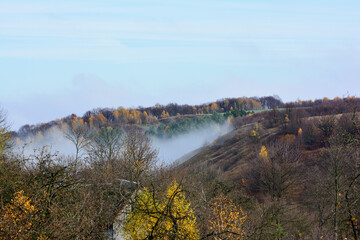 Fog spreads across the valley in the village