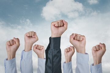 Businessmen groups of hand raised to sky and sunlight business people Celebration of victory Of...