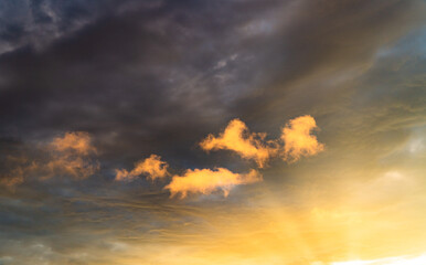clouds in the sky while the golden hour