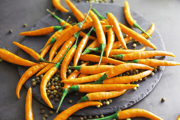 Hot orange pepper. Chilean pepper on a black.