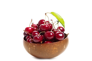 Plate with sweet cherries isolated on a white background