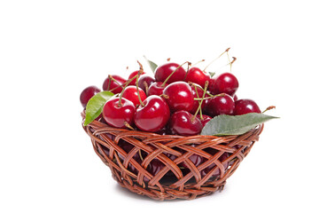 Sweet cherries in a basket isolated on a white background