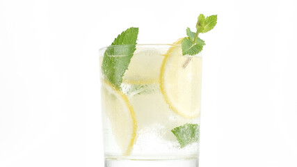 sparkling water in glass with ice, lemon and mint. Refreshing drink with sparkling water, lemon and mint, lemonade