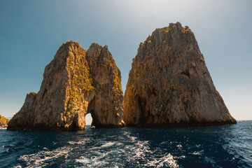 Amazing sunny day in Capri under the Faraglioni, South of Italy.