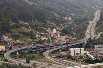 Aerial view of a road junction in a green valley of the north of Spain