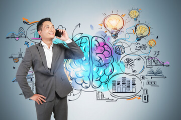 Smiling Asian man on phone, business idea