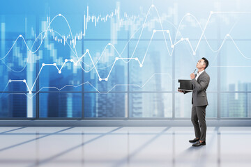 Asian man in office, financial graph