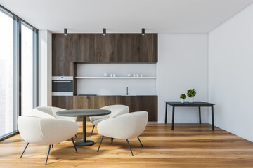 White and wooden kitchen with dining table