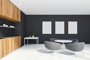 Black and wooden kitchen with poster gallery