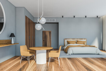 Grey master bedroom interior with table